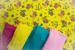 Puuvillane_trikotaaž_Erksad_lilled_kollasel_taustal